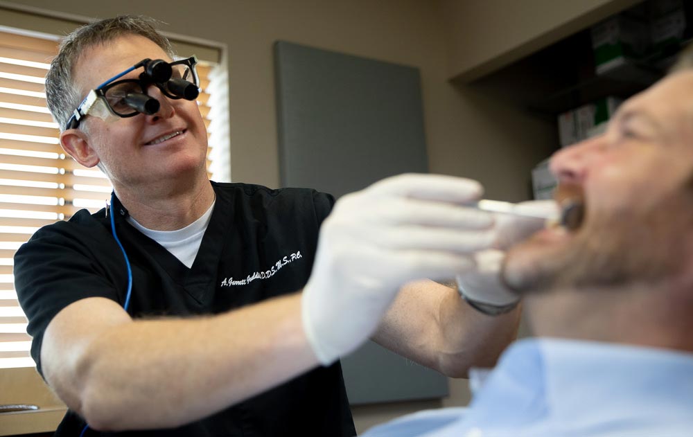 Our periodontist Dr. Gouldin during a dental procedure