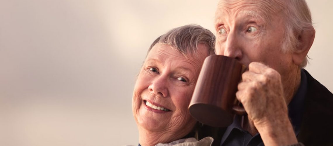Dental Implant Patients Smiling Together While Drinking Coffee